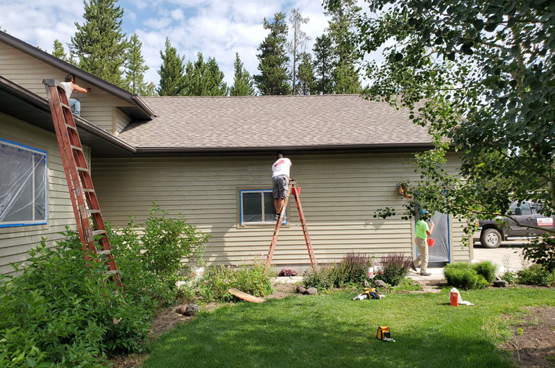 House-Painting-in-process Two workers from Gallatin Painters working on a home giving it a new paint job
